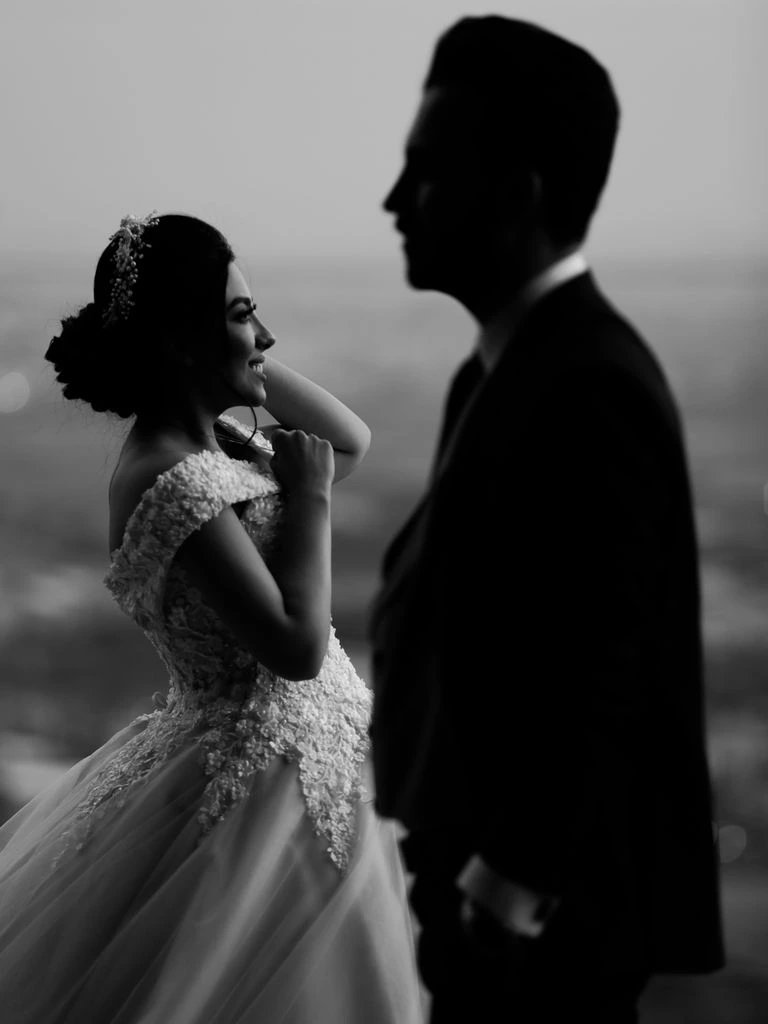 Black-and-white portrait of wedding photographer Ana Whitfield.