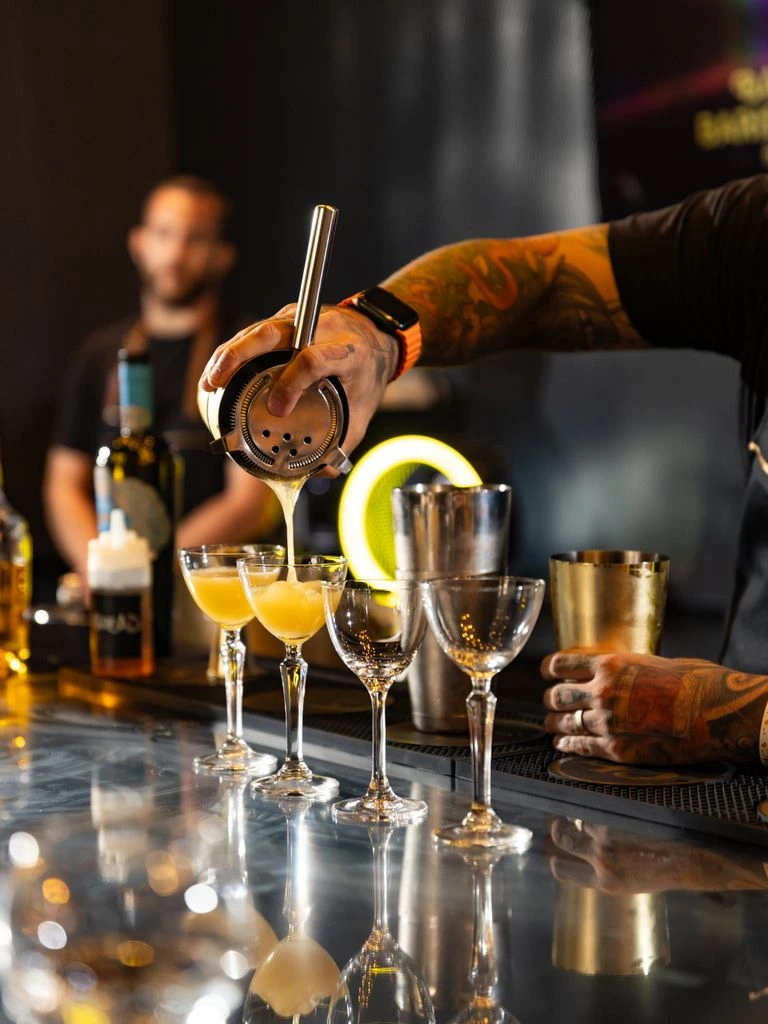 A tattoo-friendly cocktail bar set up for a wedding reception.