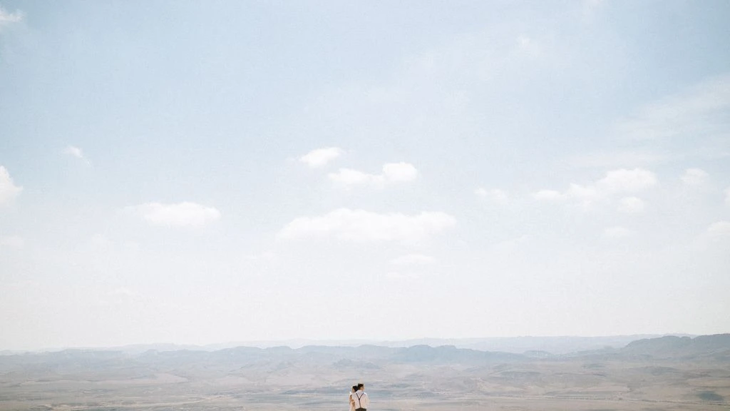 A desert wedding ceremony at golden hour in New Mexico.